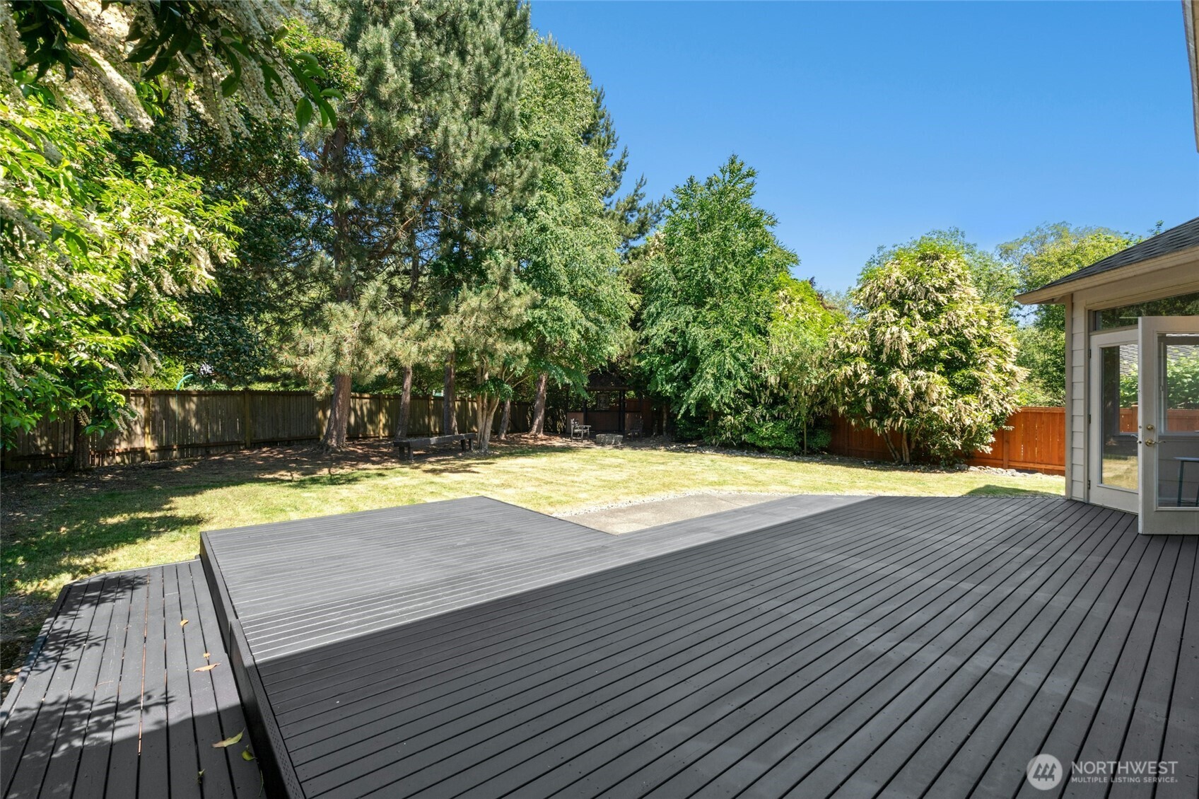 3303 174th Place Southeast Bothell, WA 98012 - Photo 29 of 32 a view of a swimming pool with an outdoor space and seating area