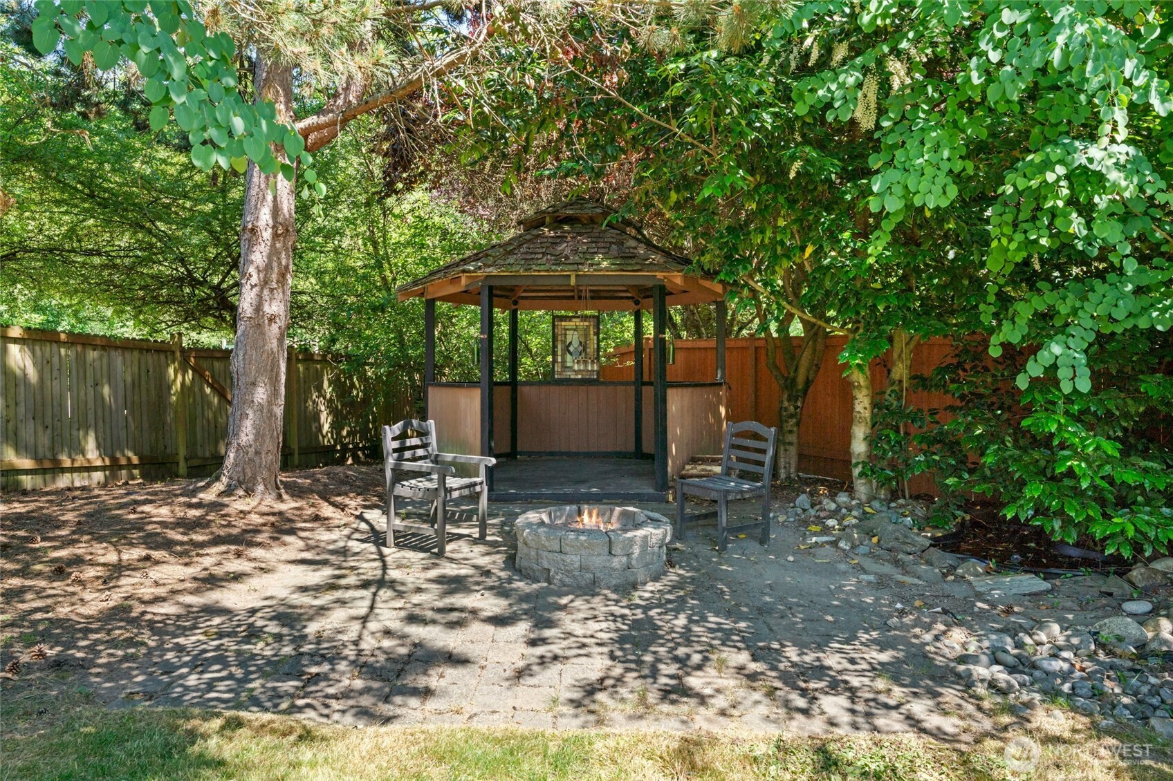 3303 174th Place Southeast Bothell, WA 98012 - Photo 31 of 32 a backyard of a house with seating space