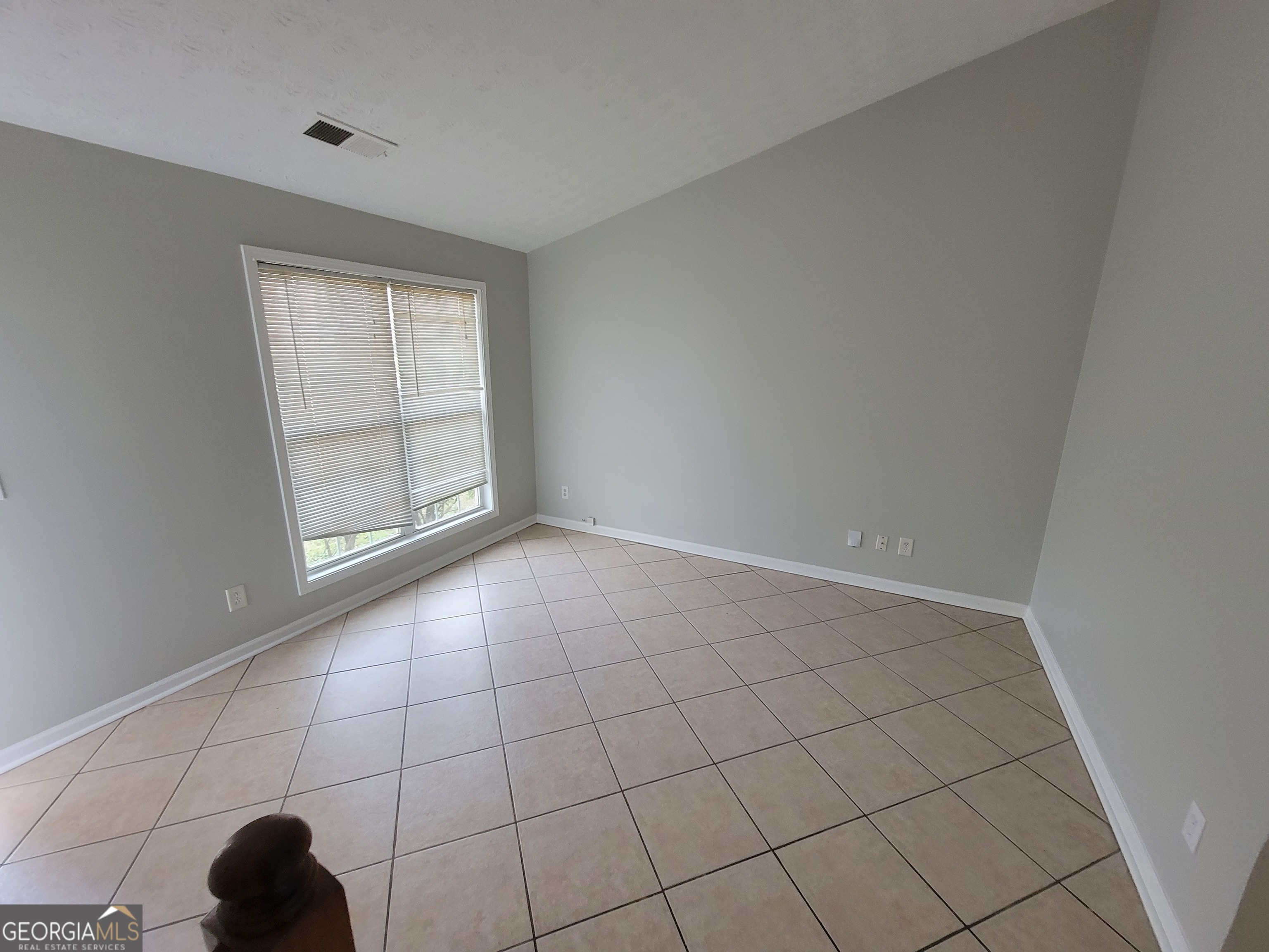 4107 Shining Armor Drive Conley, GA 30288 - Photo 7 of 14 a view of an empty room and window
