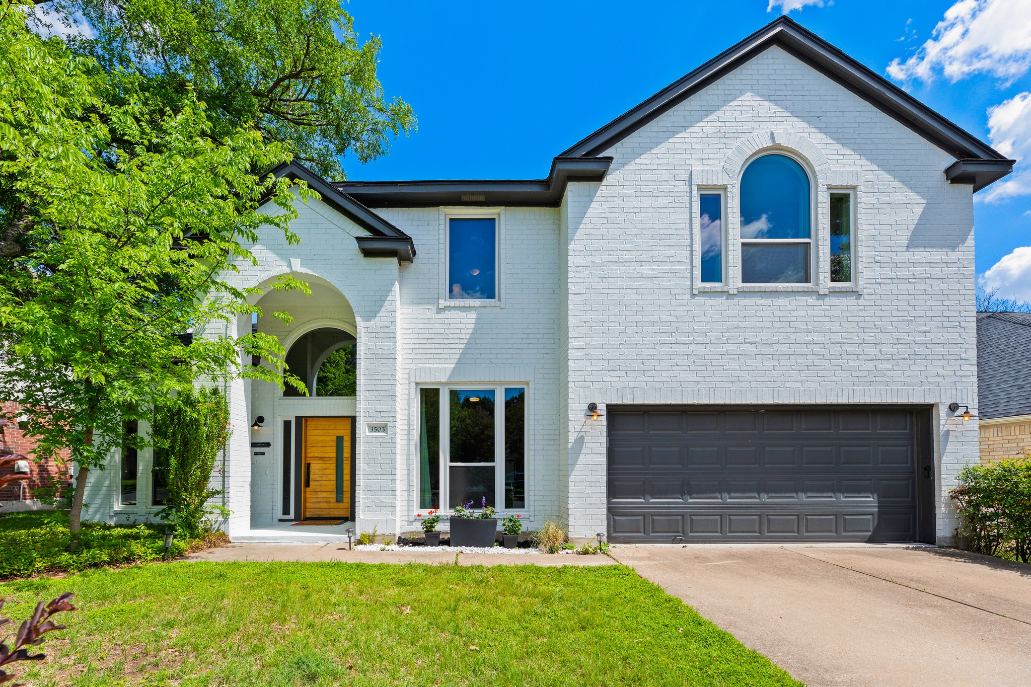 3503 Ashmere Loop Round Rock, TX 78681 - Photo 1 of 1 View of front of house with an attached garage, concrete driveway, brick siding, and a front yard