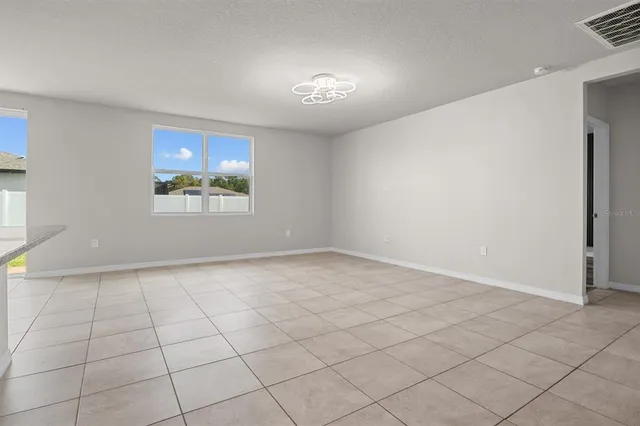 a kitchen with stainless steel appliances granite countertop a sink a stove and cabinets