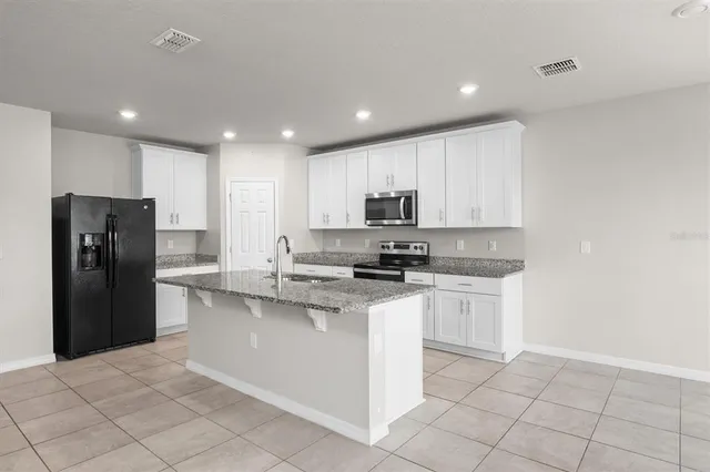 a view of a room with a closet and wooden floor