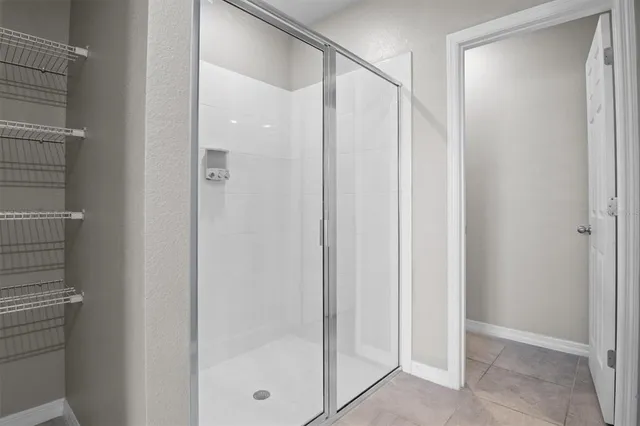 an aerial view of a house with a garden and swimming pool