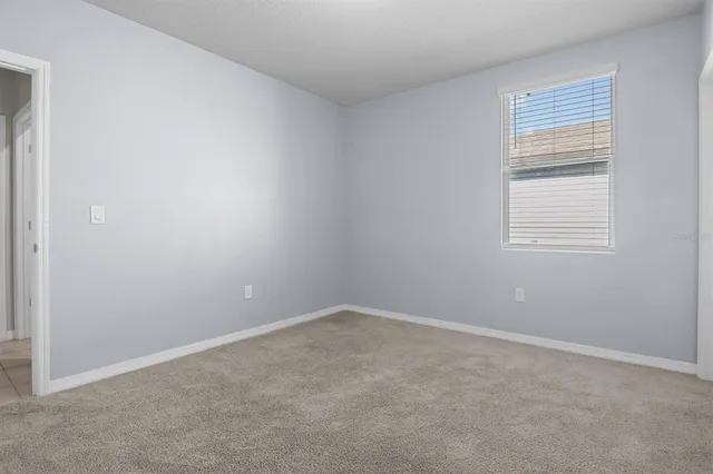 a bathroom with a granite countertop sink a toilet and bathtub