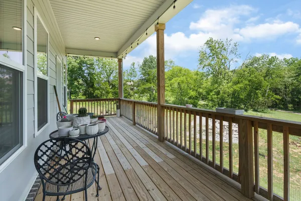 a view of balcony with furniture