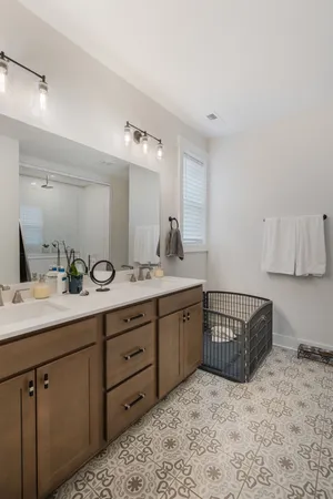 a bath room with a sink and a mirror