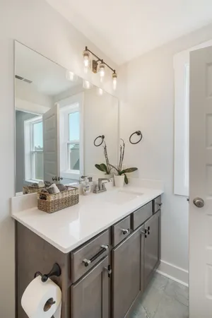 a bathroom with a sink double vanity and a mirror