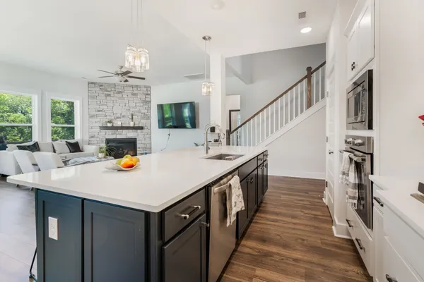 a view of kitchen and wooden floor