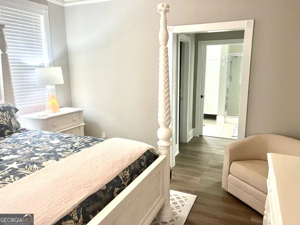 a living room with a bed and a couch