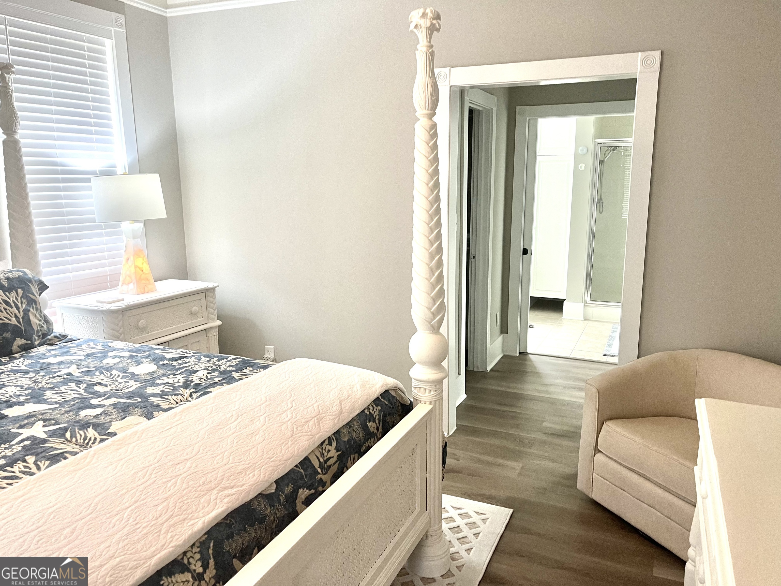 122 Shady Brook Circle, Unit 100 St. Simons, GA 31522 - Photo 16 of 39 a living room with a bed and a couch