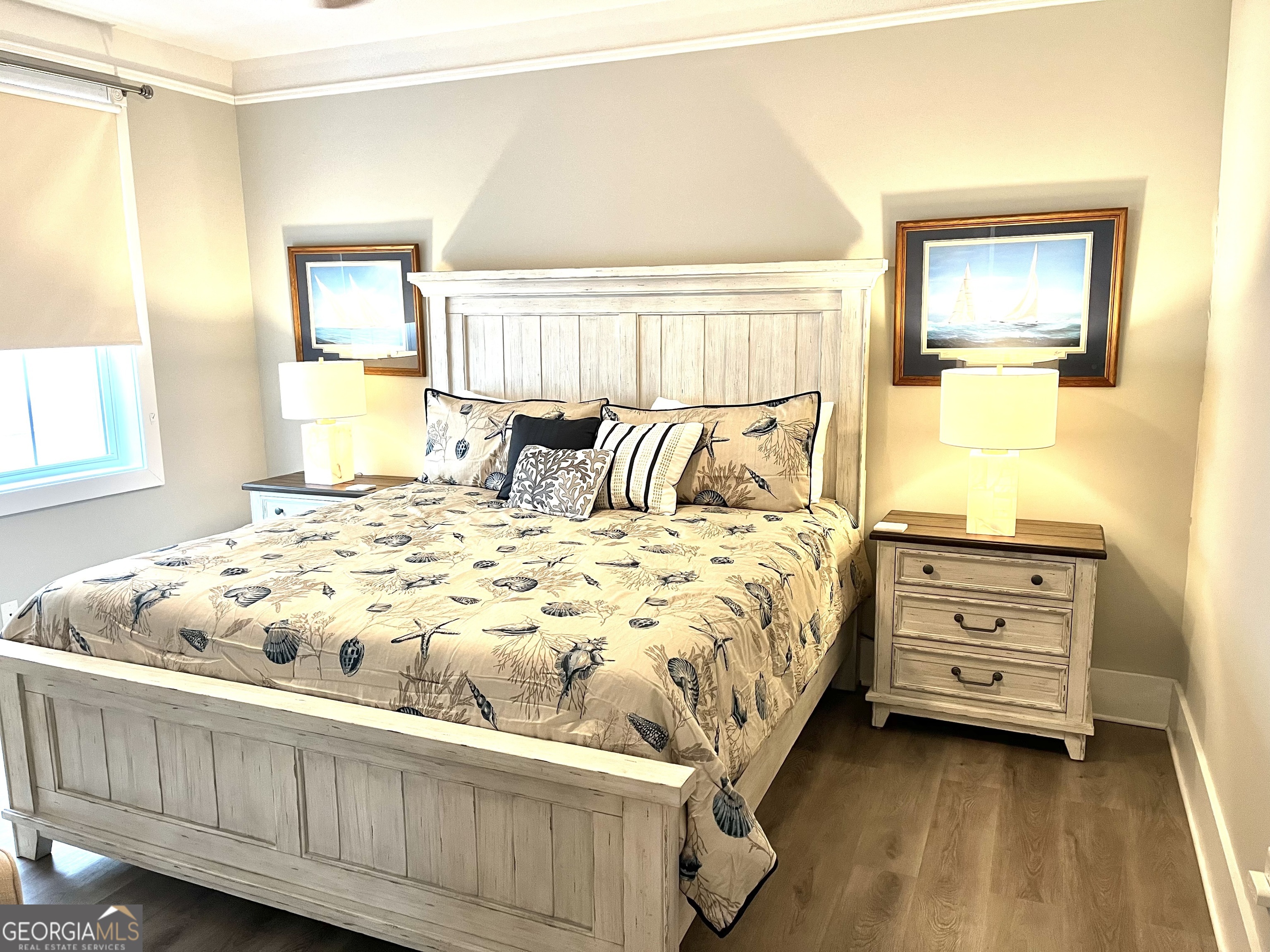 122 Shady Brook Circle, Unit 100 St. Simons, GA 31522 - Photo 22 of 39 a bedroom with a bed and a window