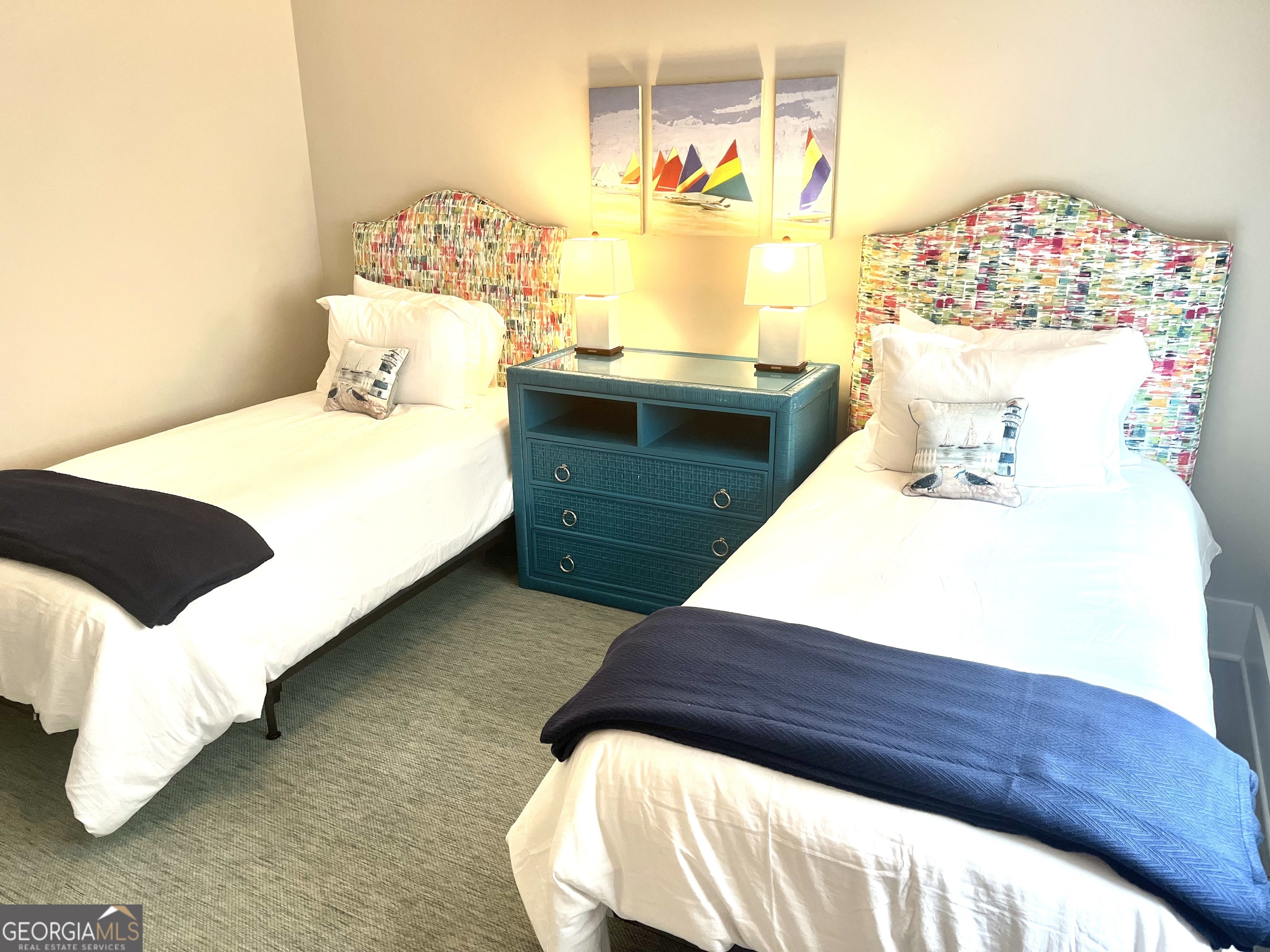 122 Shady Brook Circle, Unit 100 St. Simons, GA 31522 - Photo 27 of 39 a bathroom with a sink and a mirror