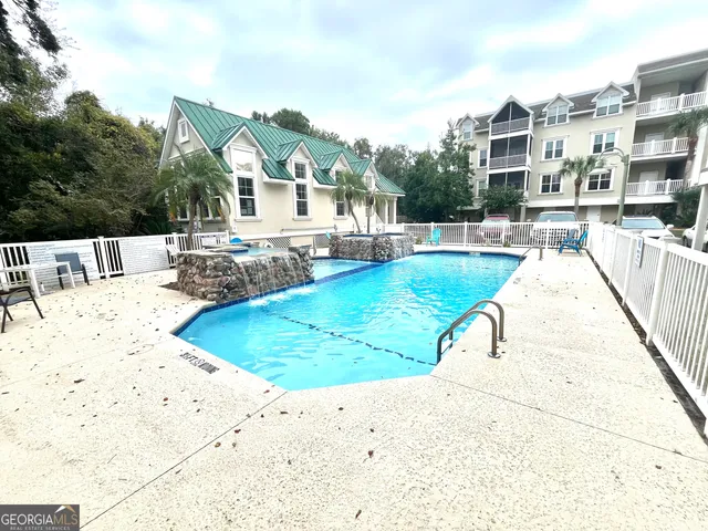 a view of a swimming pool with a patio