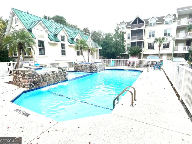 a view of a house with swimming pool