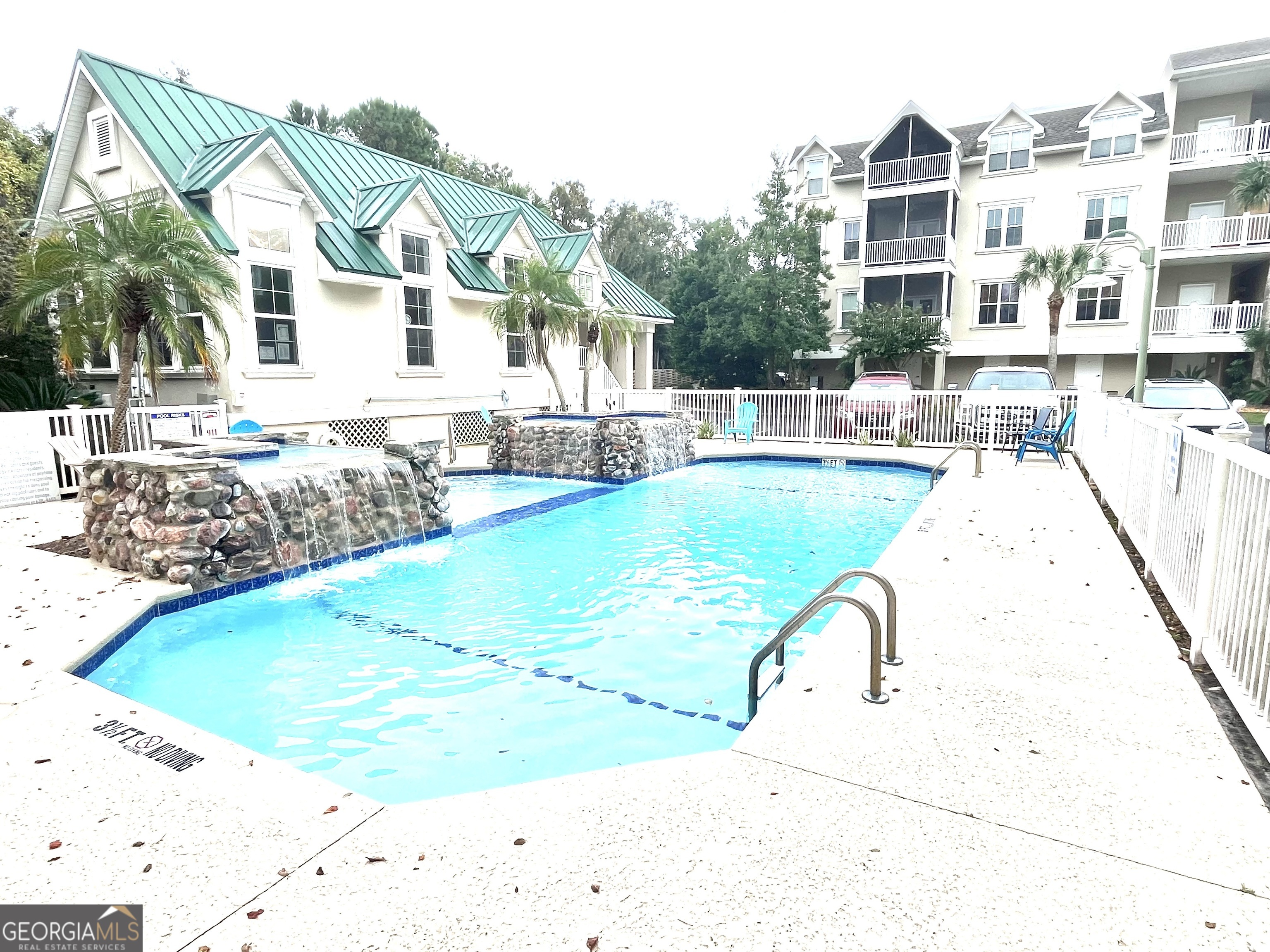 122 Shady Brook Circle, Unit 100 St. Simons, GA 31522 - Photo 34 of 39 a view of a house with swimming pool