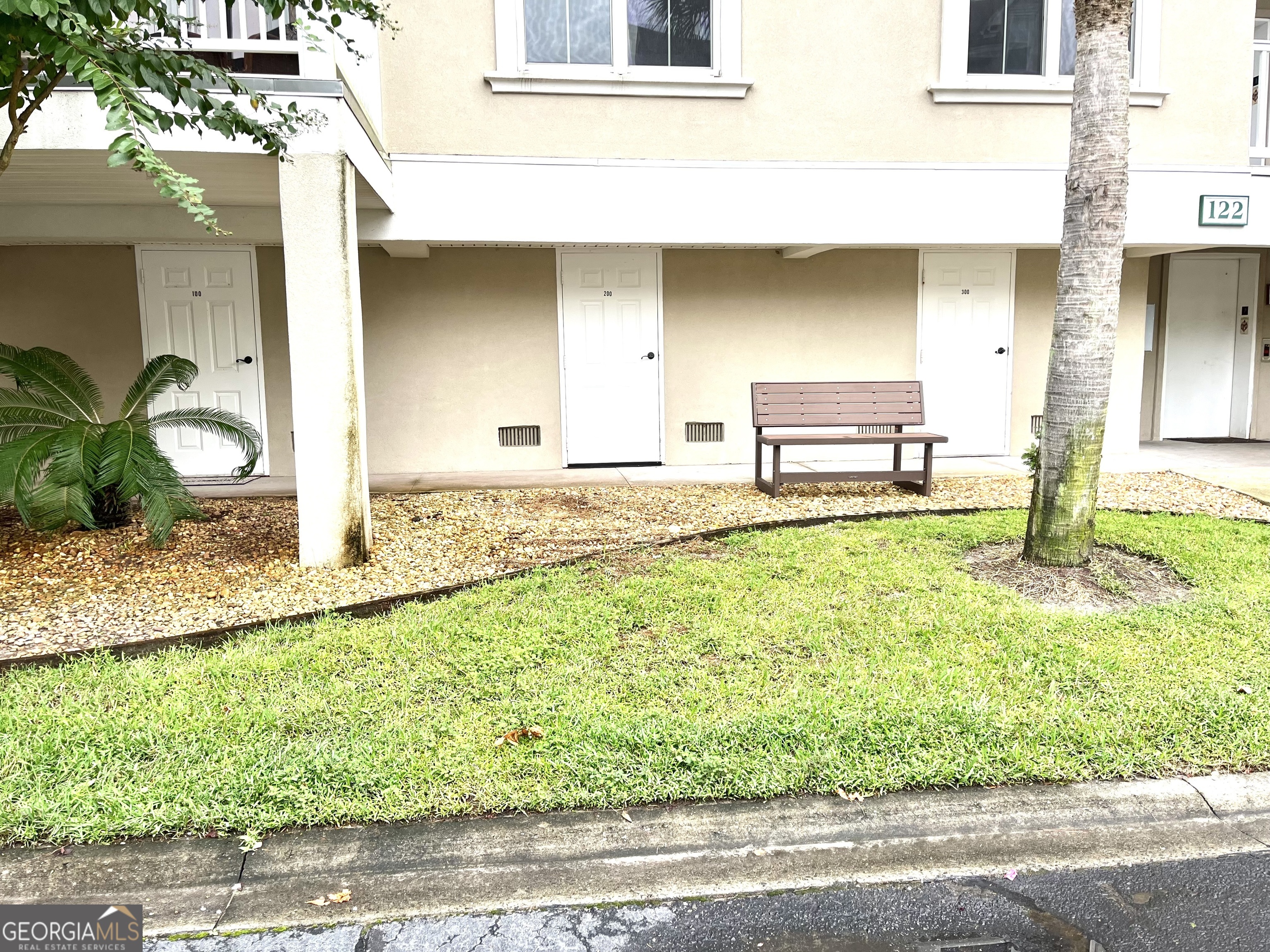 122 Shady Brook Circle, Unit 100 St. Simons, GA 31522 - Photo 36 of 39 a house view with a outdoor space