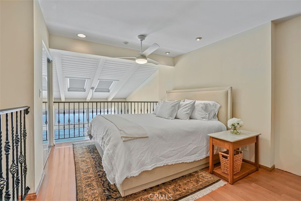 615 Esplanade, Unit 407 Redondo Beach, CA 90277 - Photo 13 of 45 a bedroom with a bed and a table