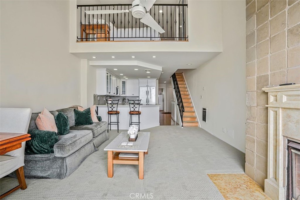 615 Esplanade, Unit 407 Redondo Beach, CA 90277 - Photo 15 of 45 a living room with furniture and kitchen view