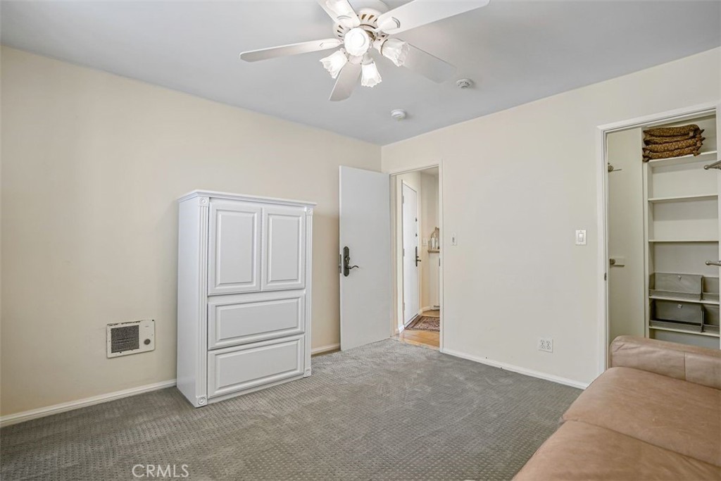615 Esplanade, Unit 407 Redondo Beach, CA 90277 - Photo 22 of 45 a view of a livingroom with a chandelier fan