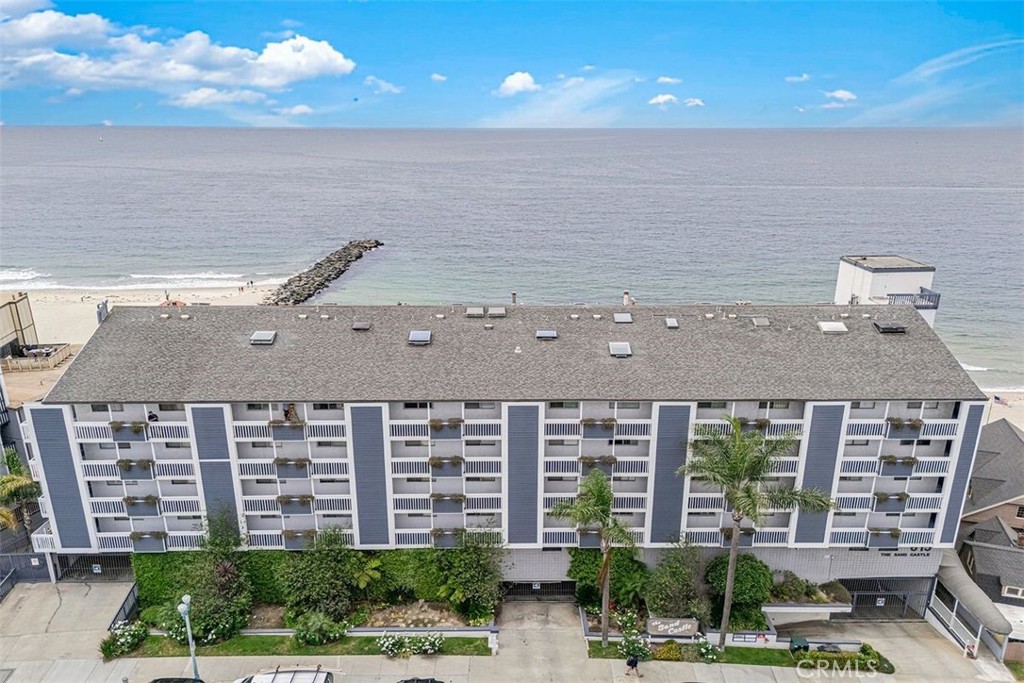 615 Esplanade, Unit 407 Redondo Beach, CA 90277 - Photo 34 of 45 a front view of building with balcony and garden space