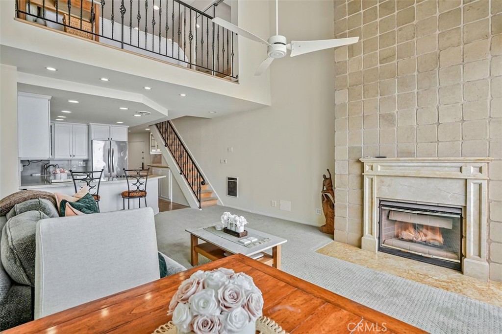 615 Esplanade, Unit 407 Redondo Beach, CA 90277 - Photo 10 of 45 a living room with furniture and a fireplace