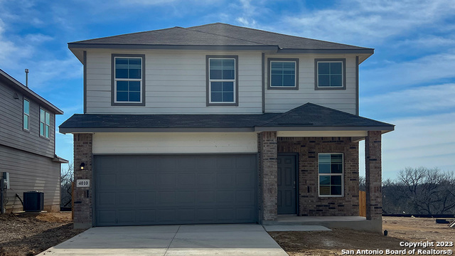 4010 Common Sage Von Ormy, TX 78073 - Photo 1 of 1 a front view of a house with garden