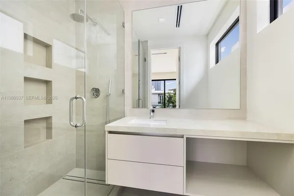 a bathroom with a sink and a mirror