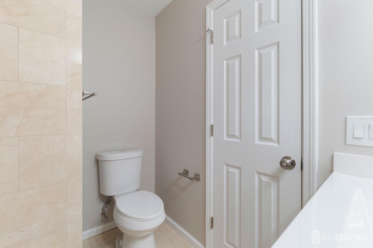 104 Jesse Way Piscataway, NJ 08854 - Photo 16 of 26 a white toilet sitting next to a shower