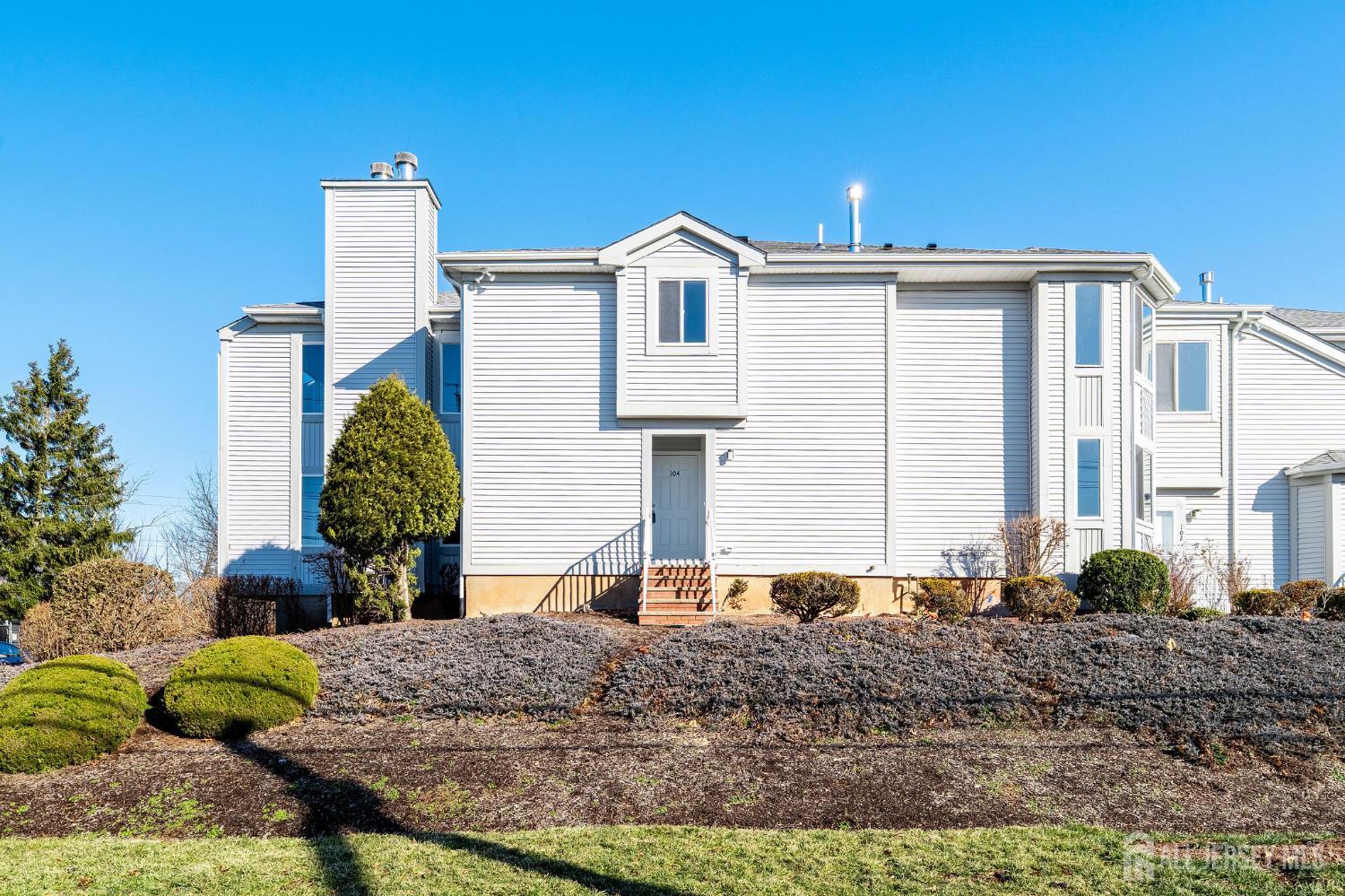 104 Jesse Way Piscataway, NJ 08854 - Photo 21 of 26 a front view of a house with garden