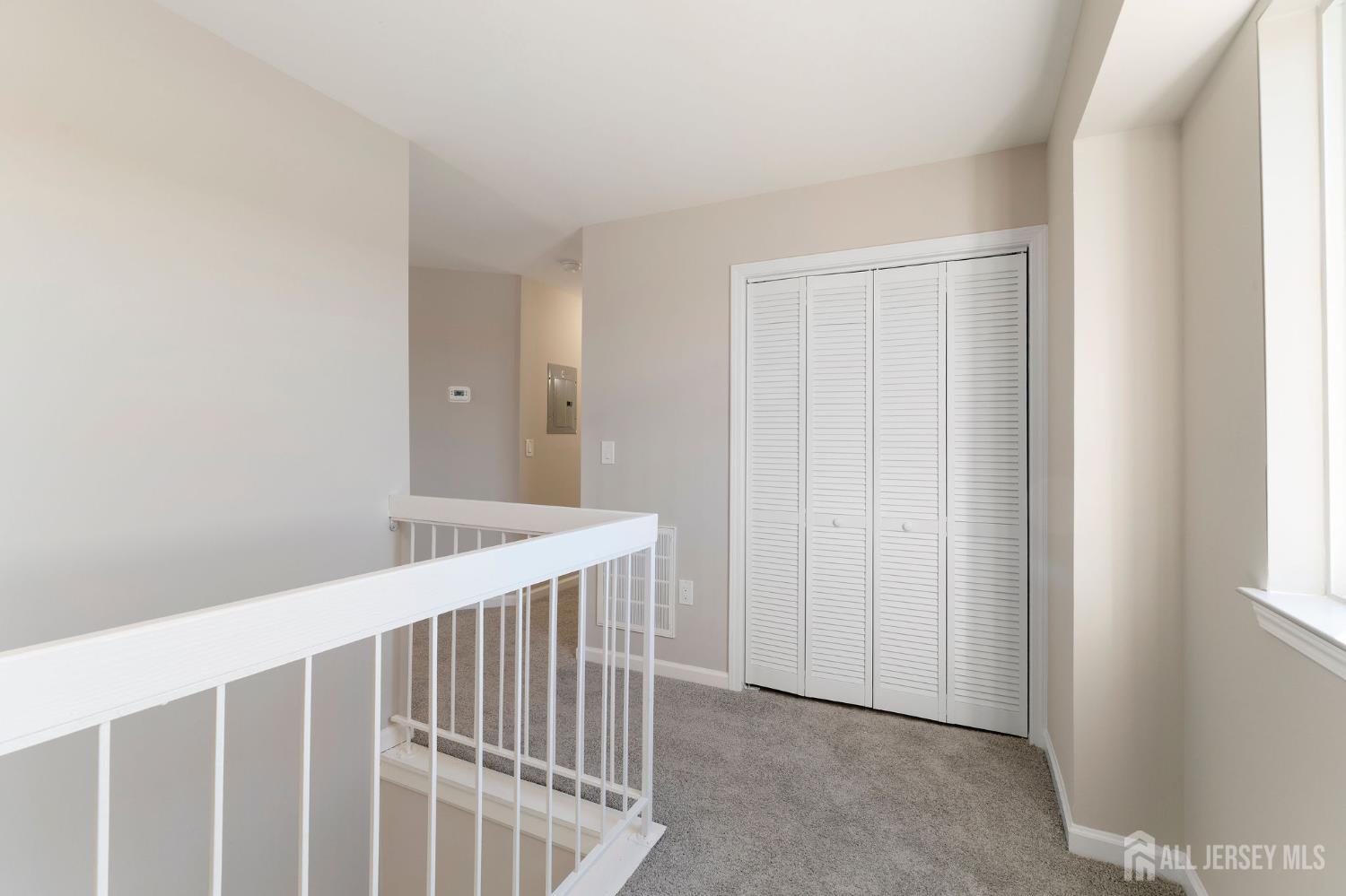 104 Jesse Way Piscataway, NJ 08854 - Photo 6 of 26 a view of a hallway with windows