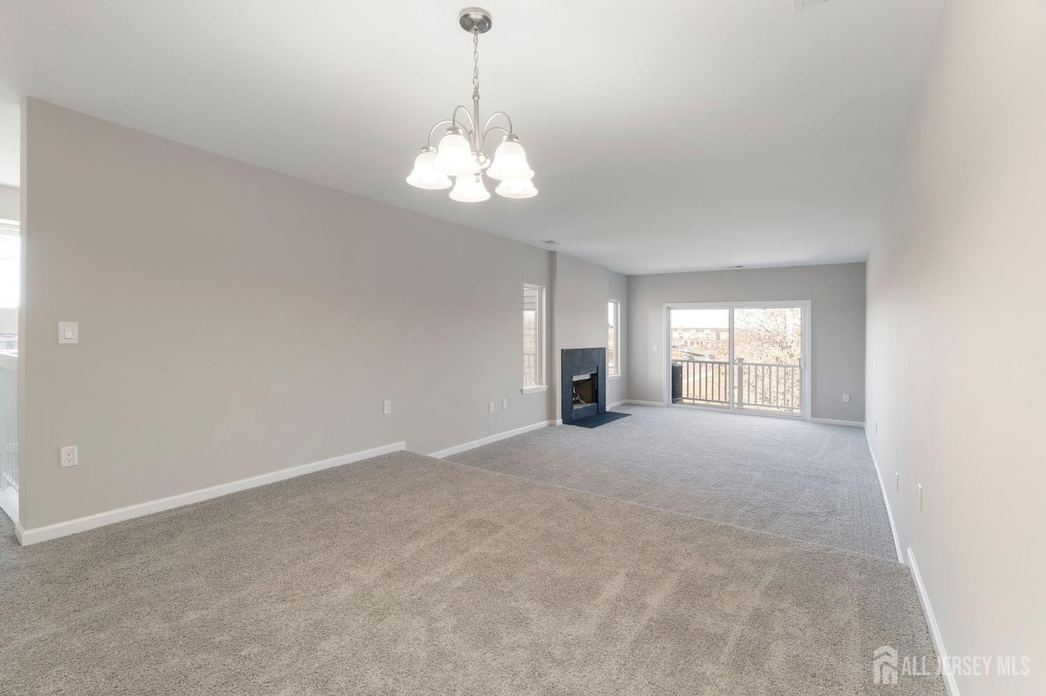 104 Jesse Way Piscataway, NJ 08854 - Photo 8 of 26 a view of empty room with a fireplace