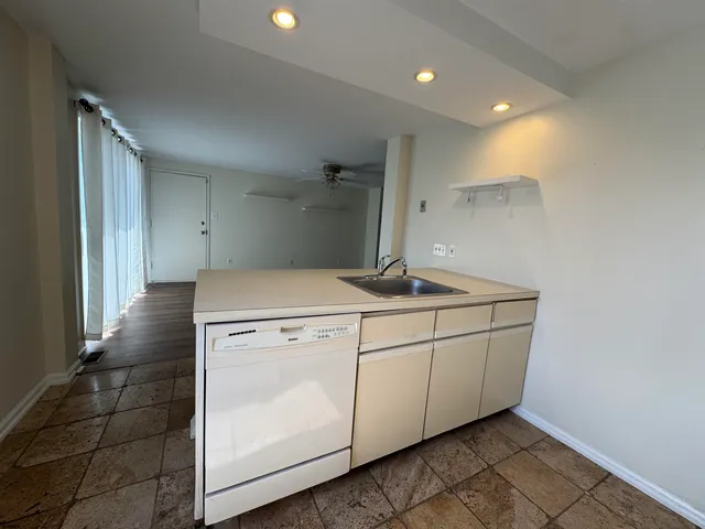 a bathroom with a sink and mirror