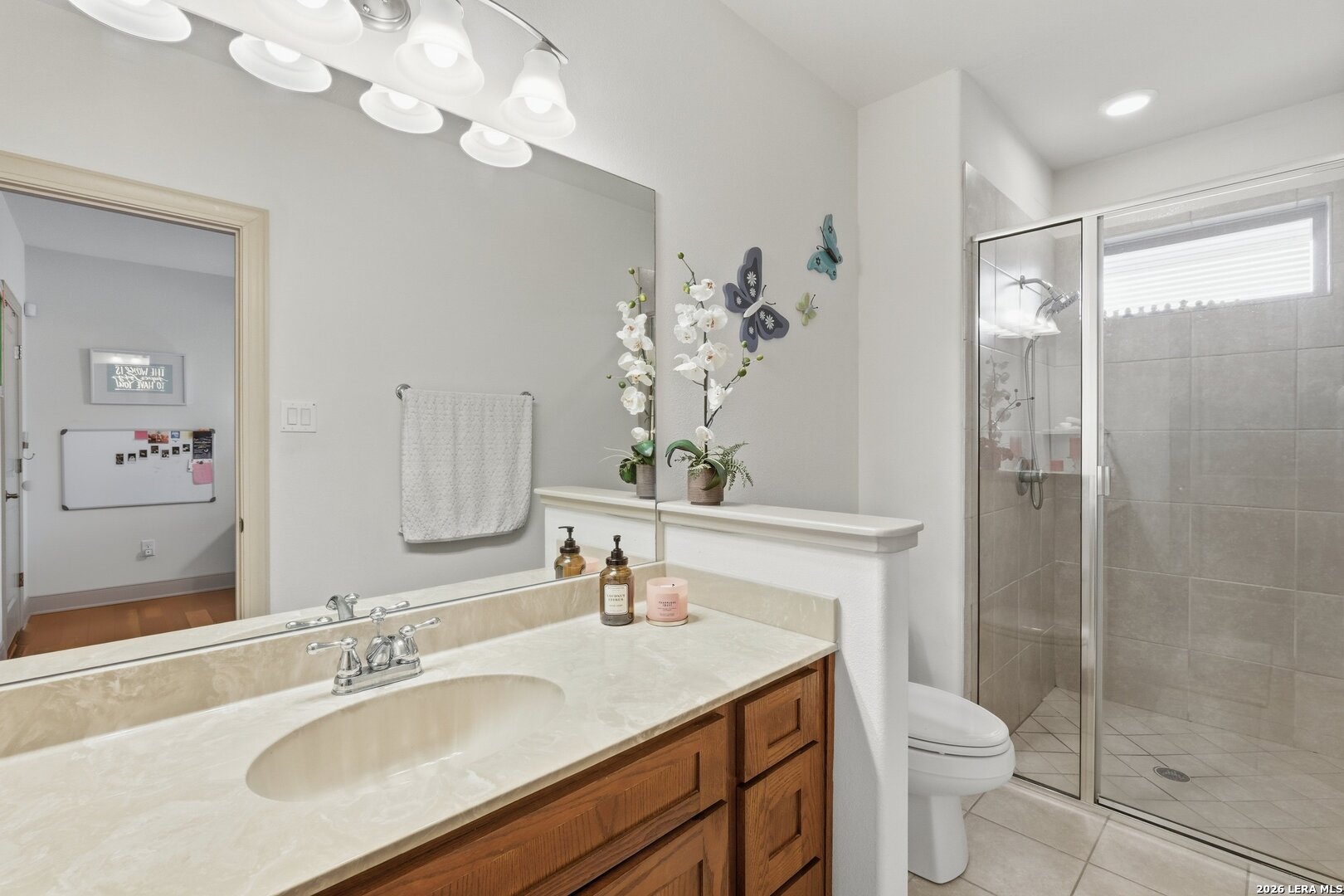 426 Legacy Ridge San Antonio, TX 78258 - Photo 24 of 38 a bathroom with a sink a toilet and shower
