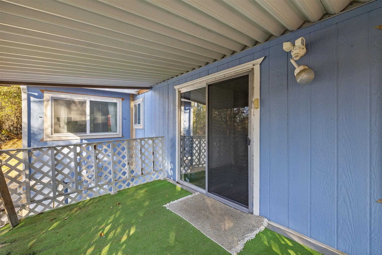 10956 Green Street, Unit 122 Columbia, CA 95310 - Photo 18 of 22 Property entrance with a lawn