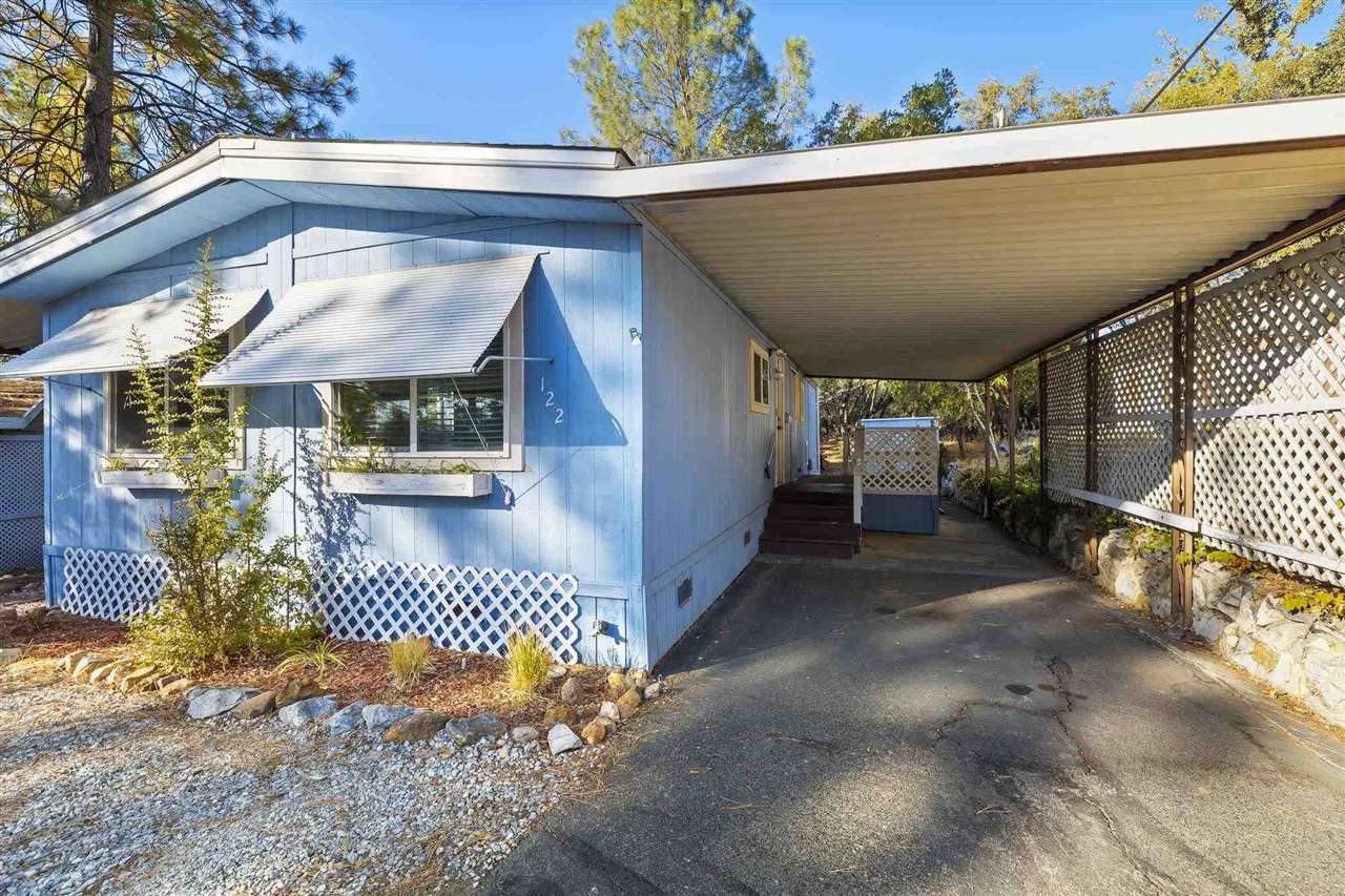 10956 Green Street, Unit 122 Columbia, CA 95310 - Photo 22 of 22 View of side of home featuring a carport