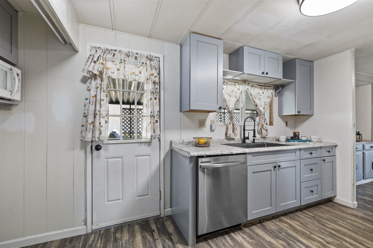 10956 Green Street, Unit 122 Columbia, CA 95310 - Photo 3 of 22 Kitchen with dishwasher, dark wood-type flooring, sink, and gray cabinets