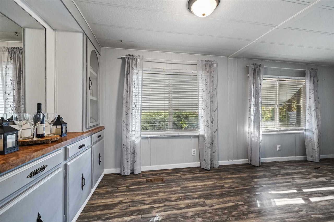 10956 Green Street, Unit 122 Columbia, CA 95310 - Photo 6 of 22 Interior space featuring butcher block counters, dark hardwood / wood-style floors, and a healthy amount of sunlight