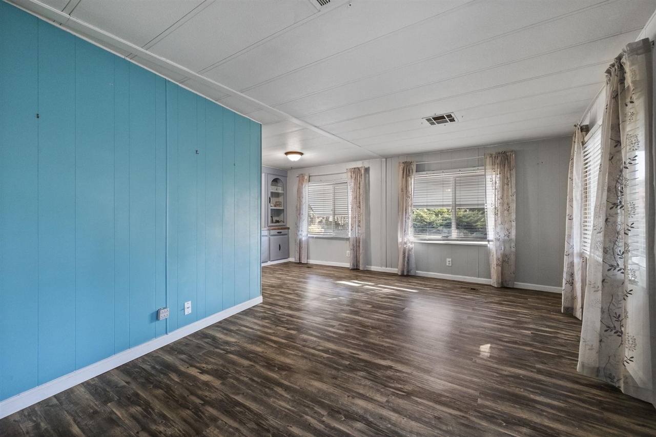 10956 Green Street, Unit 122 Columbia, CA 95310 - Photo 8 of 22 Living room with dark hardwood / wood-style floors