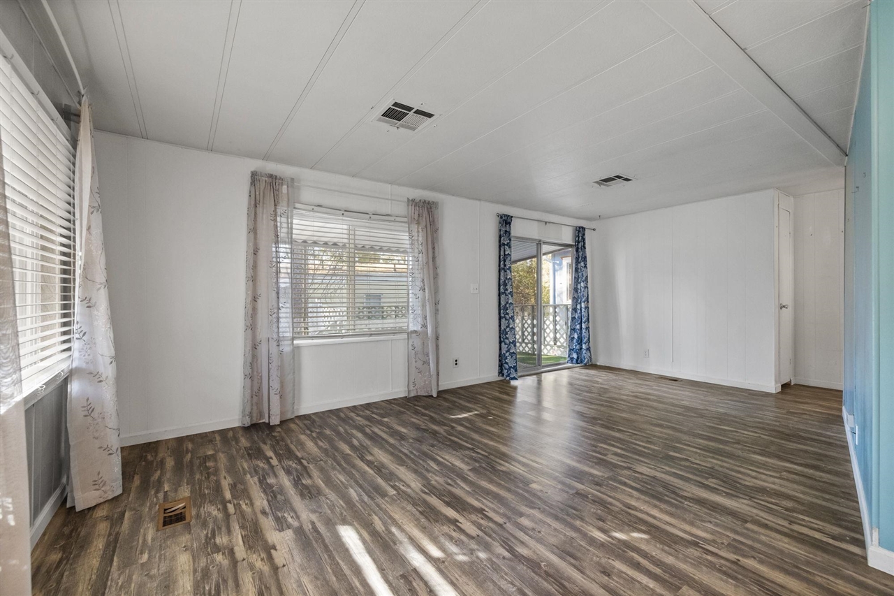 10956 Green Street, Unit 122 Columbia, CA 95310 - Photo 10 of 22 Empty room with dark hardwood / wood-style flooring