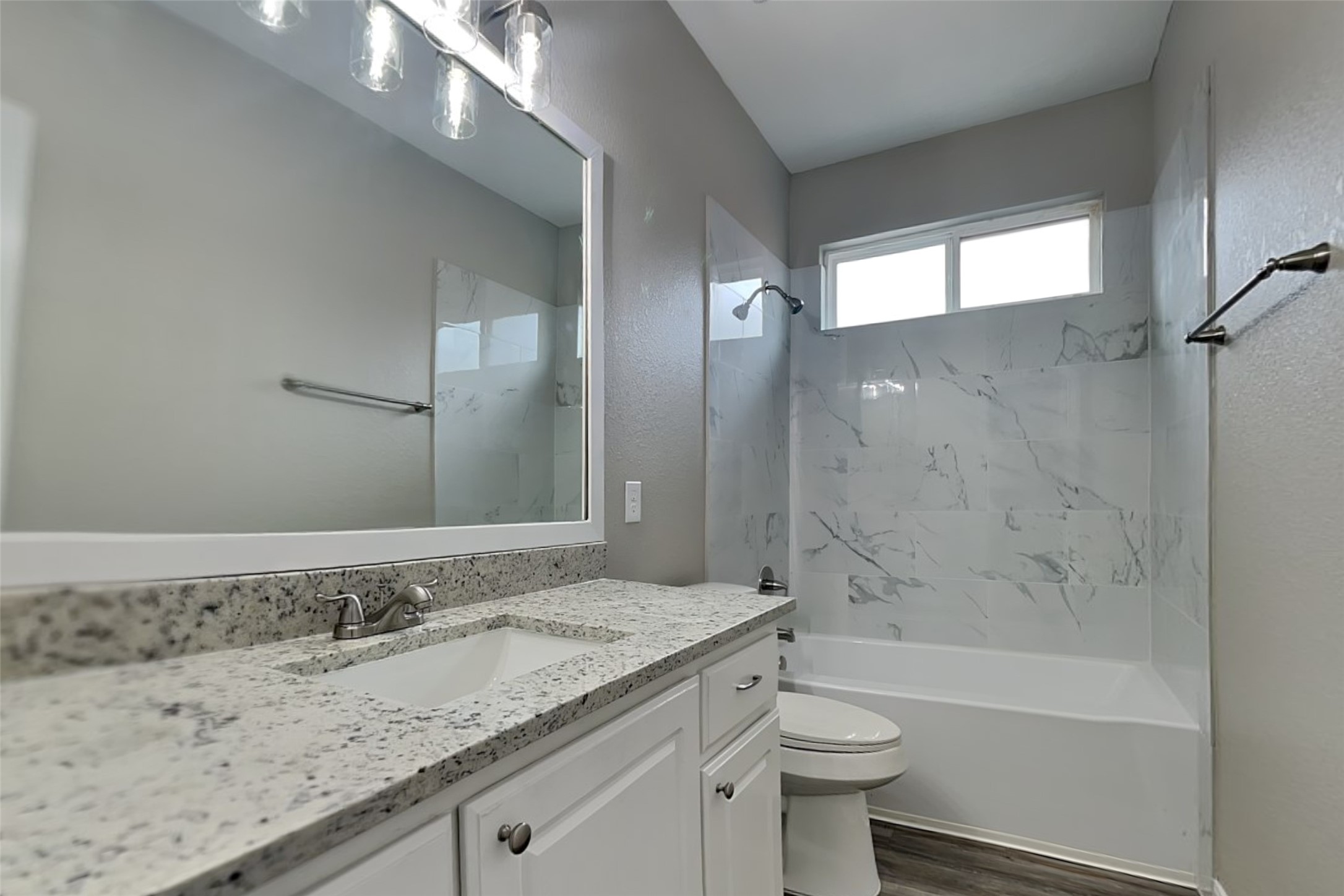 9435 Edgeloch Drive Spring, TX 77379 - Photo 14 of 18 a bathroom with a granite countertop sink toilet and shower
