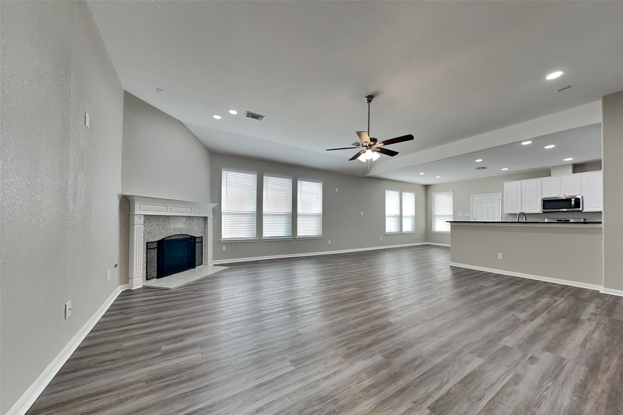 9435 Edgeloch Drive Spring, TX 77379 - Photo 4 of 18 a view of an empty room with window and wooden floor
