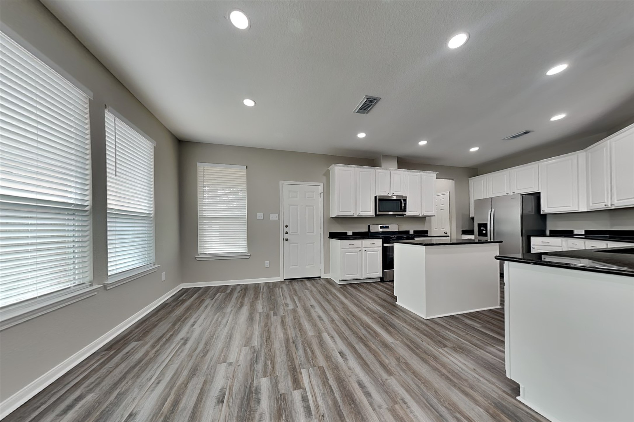9435 Edgeloch Drive Spring, TX 77379 - Photo 7 of 18 a view of kitchen with sink and wooden floor