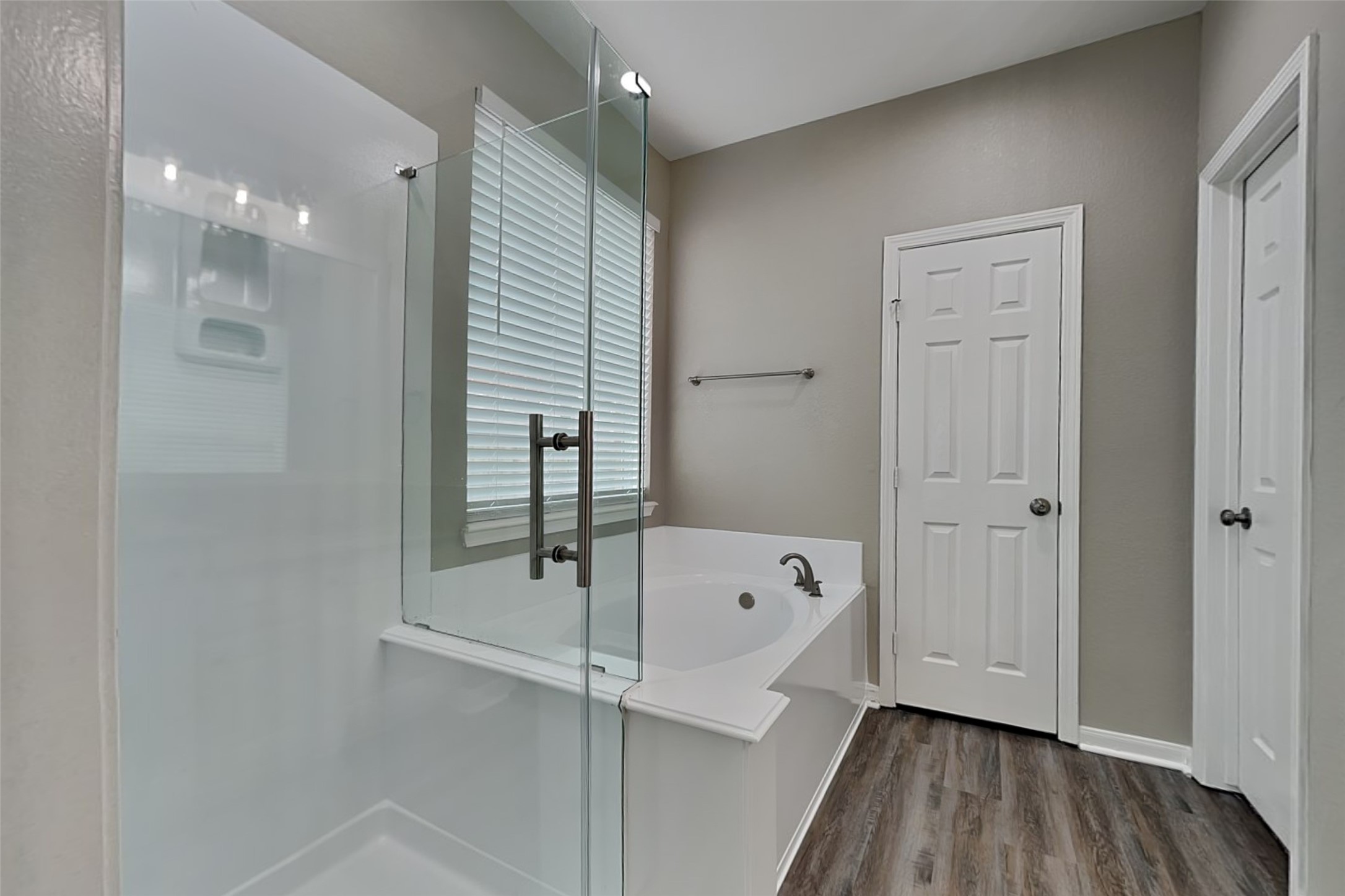 9435 Edgeloch Drive Spring, TX 77379 - Photo 10 of 18 a bathroom with a bathtub and a shower