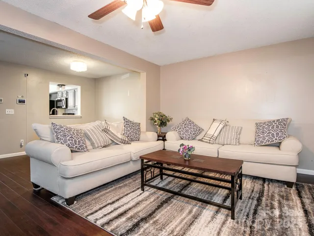 a living room with furniture and a rug