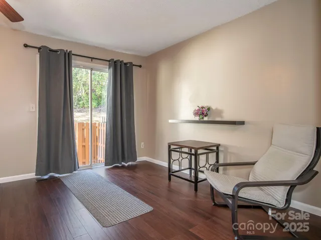 a view of a livingroom with furniture and wooden floor