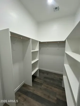 a view of an empty walk in closet