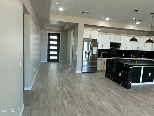 an empty room with wooden floor