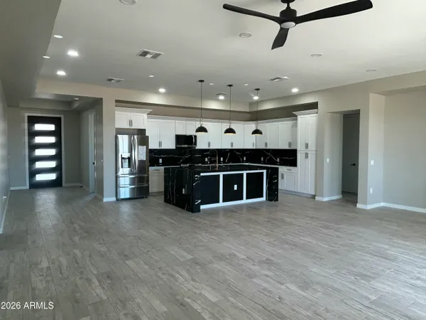 a stove top oven sitting inside of a kitchen