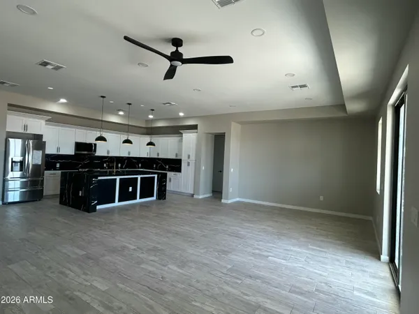 a kitchen with a sink a window and stainless steel appliances