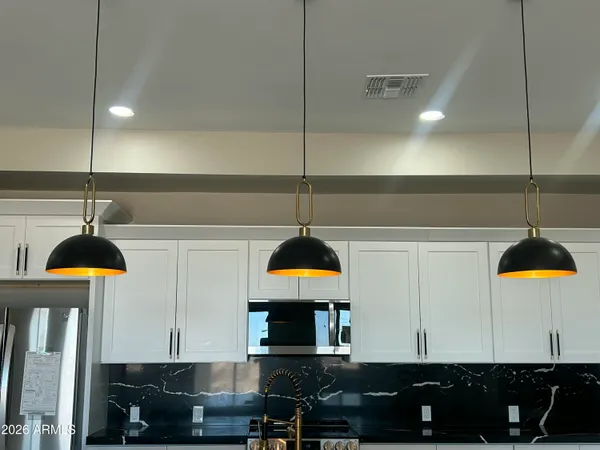 a kitchen with a refrigerator and a sink